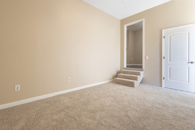 empty room featuring carpet flooring