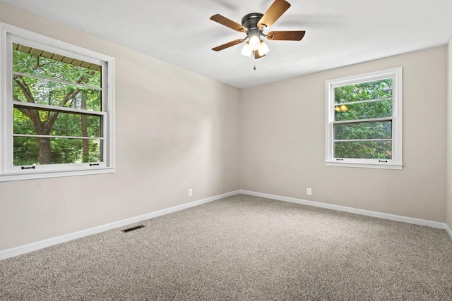 carpeted empty room with ceiling fan