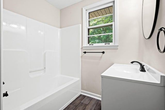 bathroom featuring shower / tub combination, vanity, and hardwood / wood-style flooring