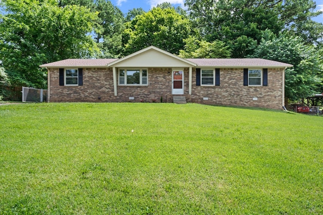 single story home featuring a front lawn