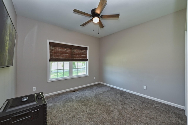 carpeted empty room with ceiling fan