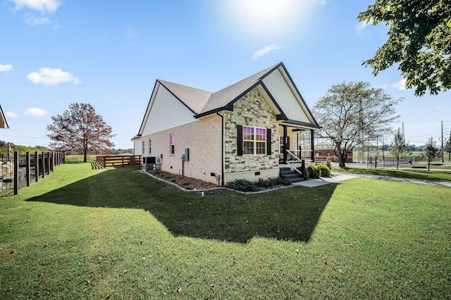 view of side of home featuring a lawn