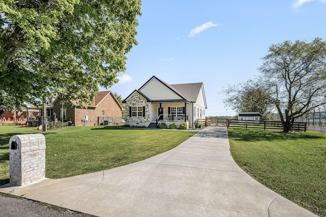 view of front of property with a porch and a front lawn