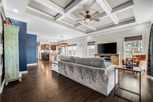 living room with beamed ceiling, crown molding, and coffered ceiling