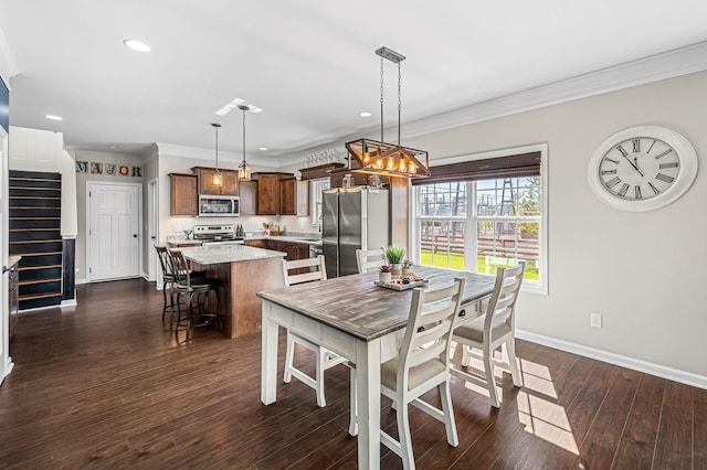 dining area featuring crown molding and dark wood-type flooring