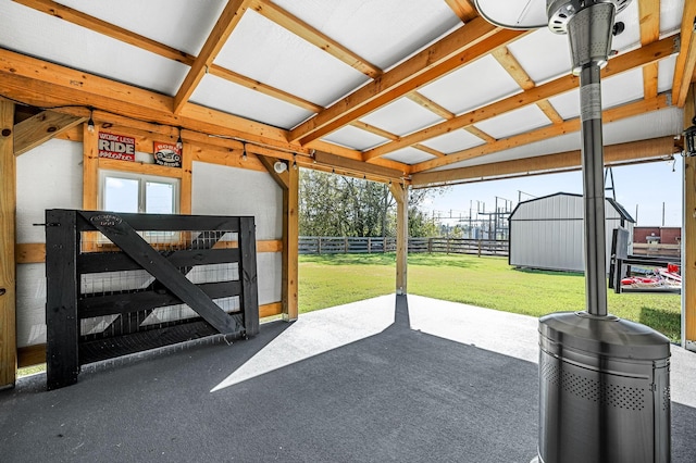 view of patio featuring a storage unit