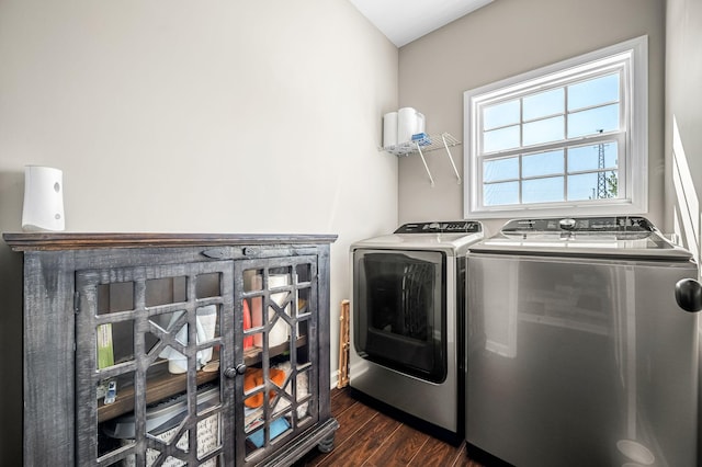 clothes washing area featuring dark hardwood / wood-style flooring and separate washer and dryer