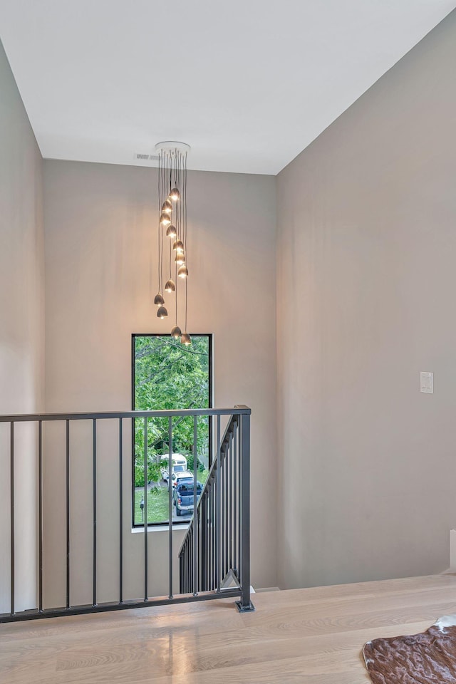 stairway with hardwood / wood-style floors