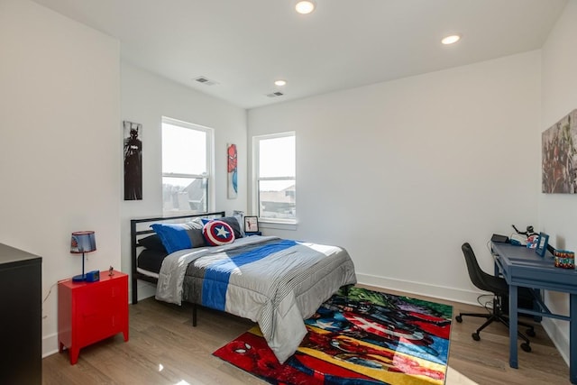 bedroom with hardwood / wood-style floors