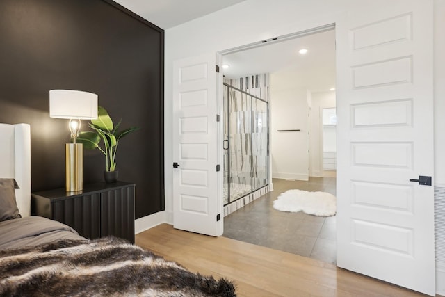 bedroom featuring wood-type flooring