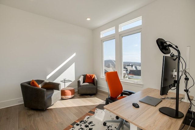 office area with hardwood / wood-style floors and plenty of natural light