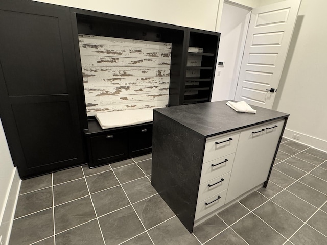 office space featuring dark tile patterned flooring