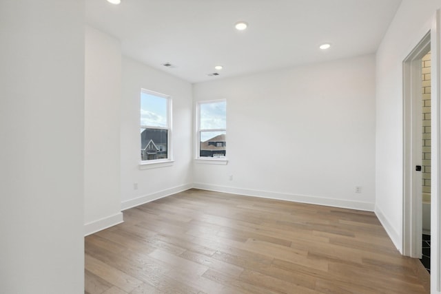 spare room with light wood-type flooring