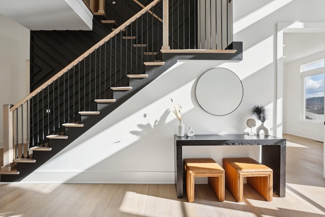 stairway with hardwood / wood-style flooring