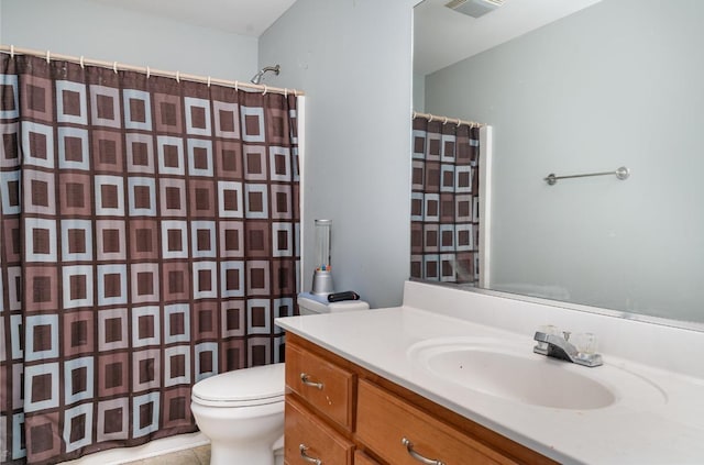 bathroom featuring tile patterned flooring, vanity, a shower with shower curtain, and toilet