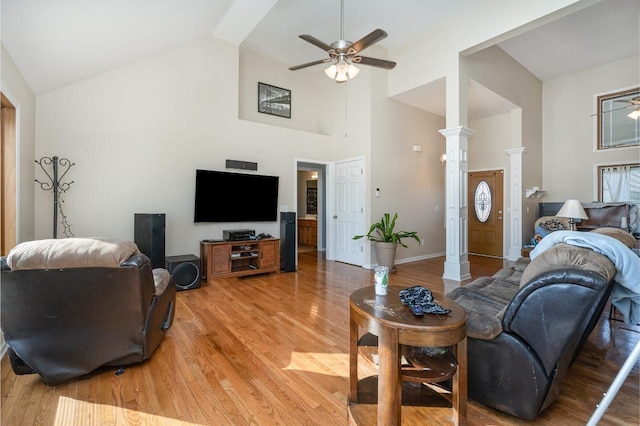 living room with vaulted ceiling, light hardwood / wood-style flooring, and ceiling fan