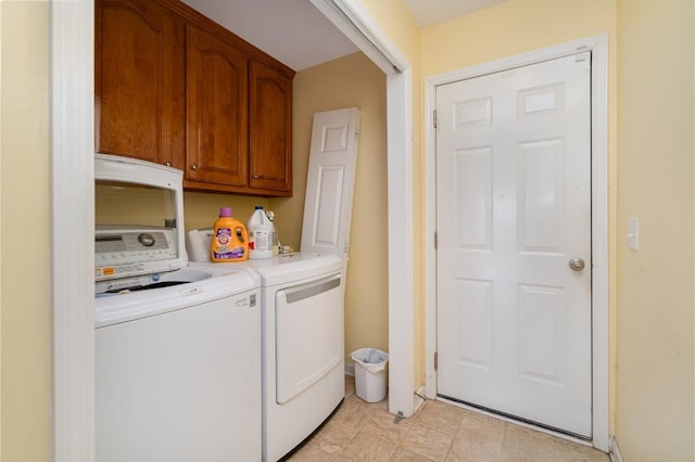 laundry room with cabinets and independent washer and dryer