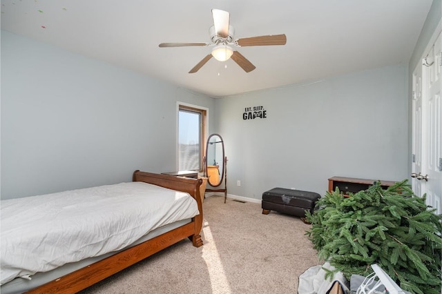 bedroom with light carpet and ceiling fan