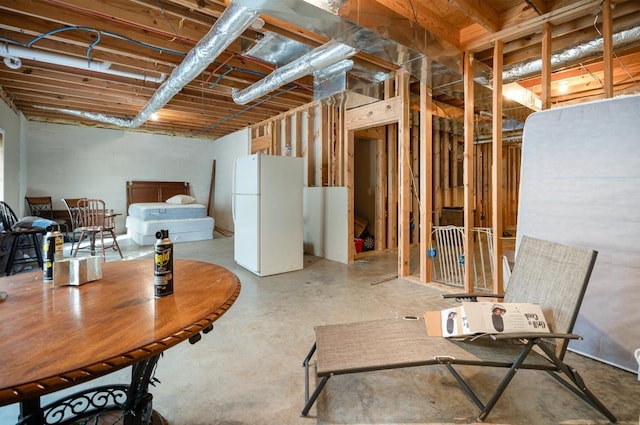 basement with white fridge