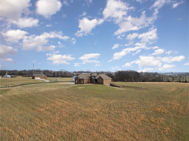 view of yard with a rural view