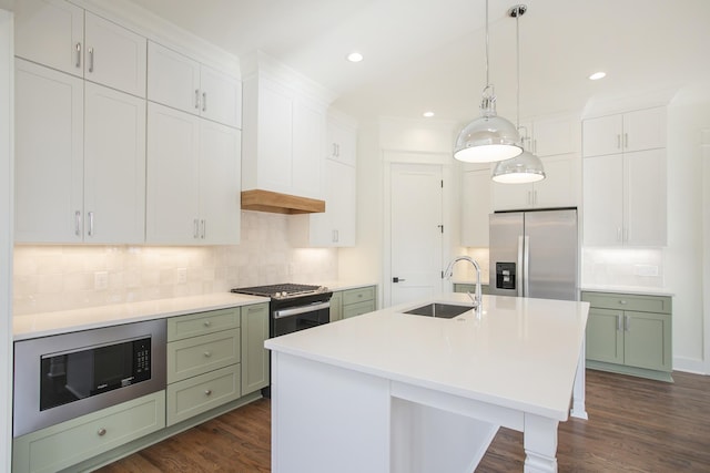 kitchen featuring white cabinetry, appliances with stainless steel finishes, sink, and green cabinetry