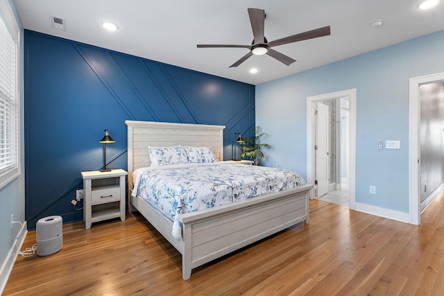 bedroom featuring hardwood / wood-style floors and ceiling fan