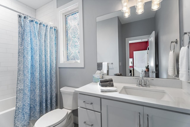 full bathroom featuring shower / bath combo with shower curtain, vanity, and toilet