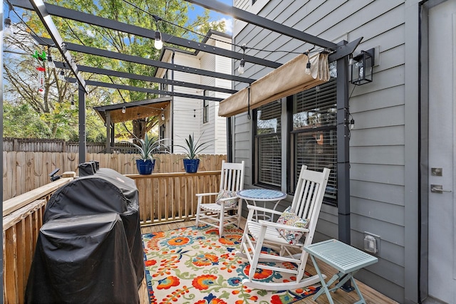 view of patio / terrace featuring a grill and a pergola