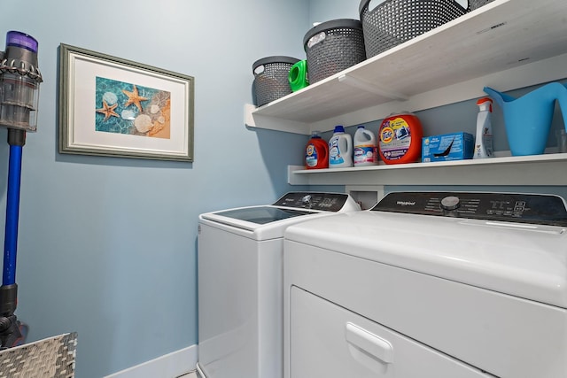 clothes washing area featuring separate washer and dryer