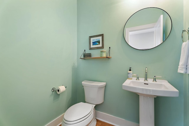 bathroom with toilet and sink