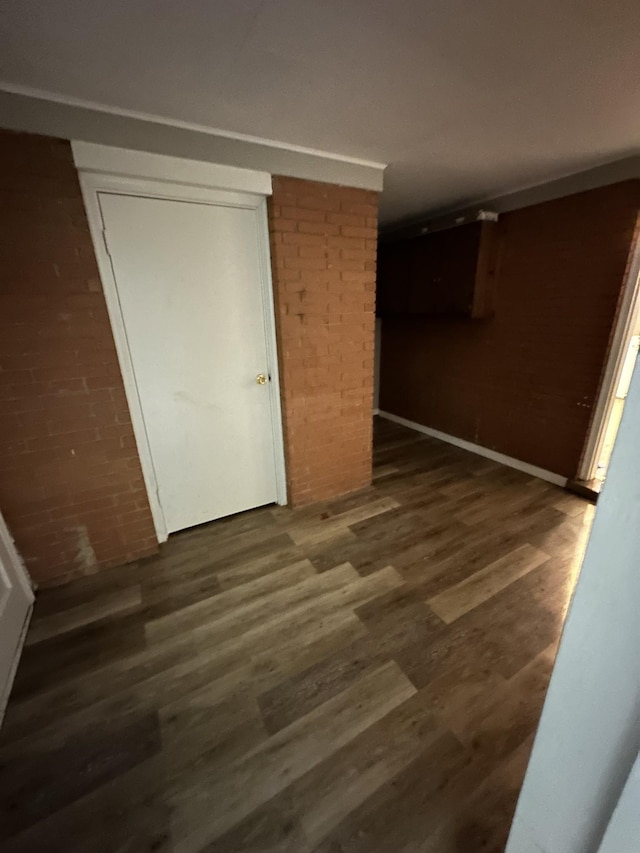 unfurnished bedroom with a closet and dark hardwood / wood-style floors