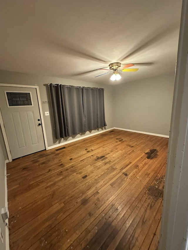 empty room with hardwood / wood-style flooring