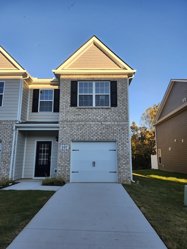 view of front facade with a garage and a front lawn