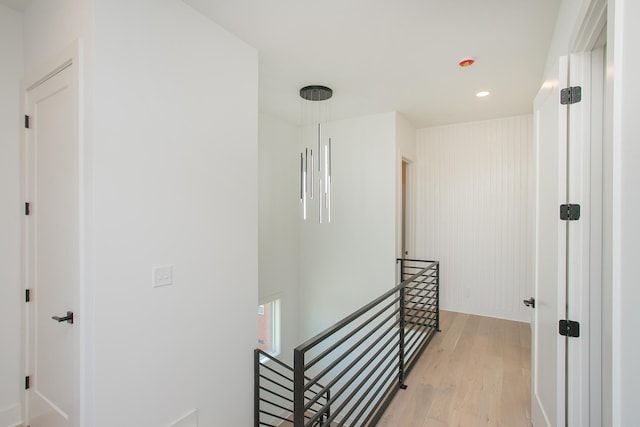 corridor with light hardwood / wood-style floors