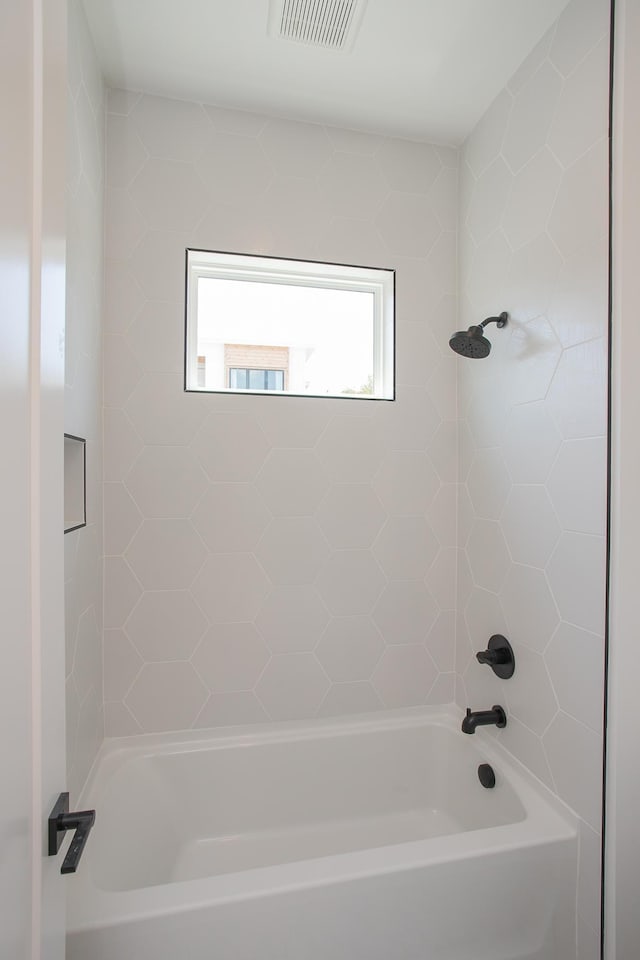 bathroom featuring washtub / shower combination