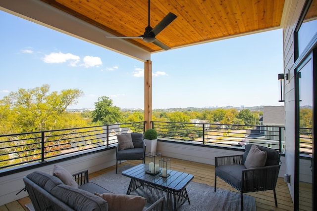 balcony with an outdoor hangout area and ceiling fan