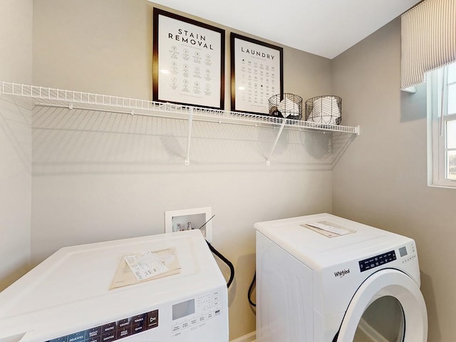 laundry room with washing machine and dryer