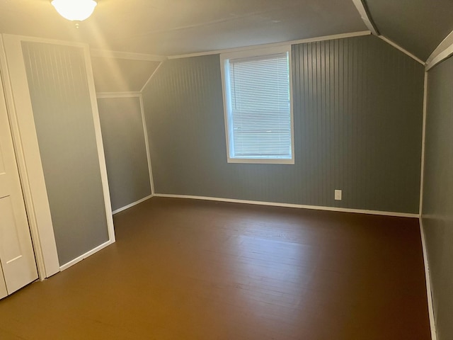 bonus room featuring hardwood / wood-style floors and lofted ceiling