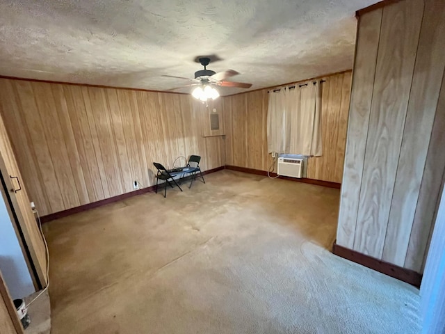 carpeted empty room featuring ceiling fan, a textured ceiling, and a wall unit AC