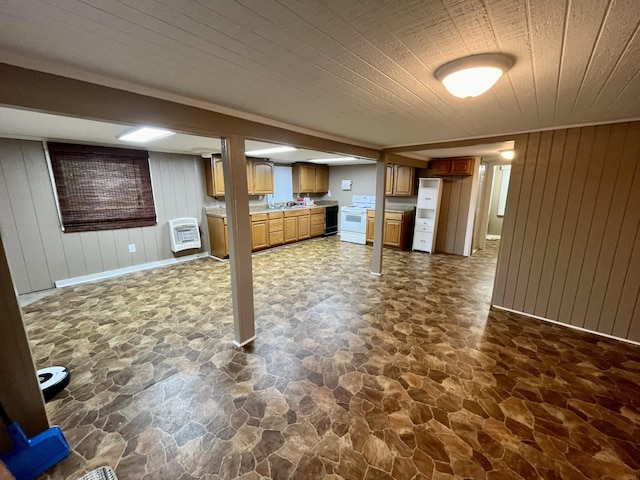 interior space featuring wood walls and heating unit