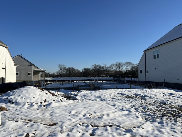 view of yard layered in snow