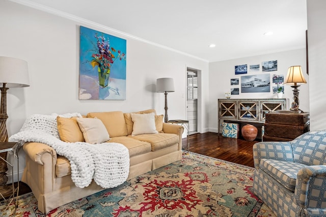 living room with hardwood / wood-style floors and crown molding