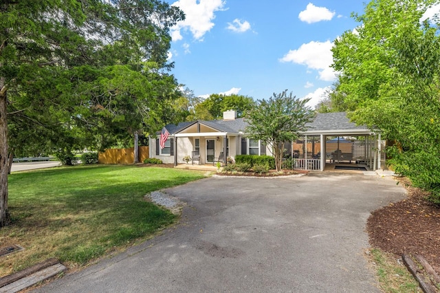 ranch-style home with a porch and a front yard