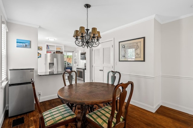 dining area with a notable chandelier, crown molding, and dark wood-type flooring