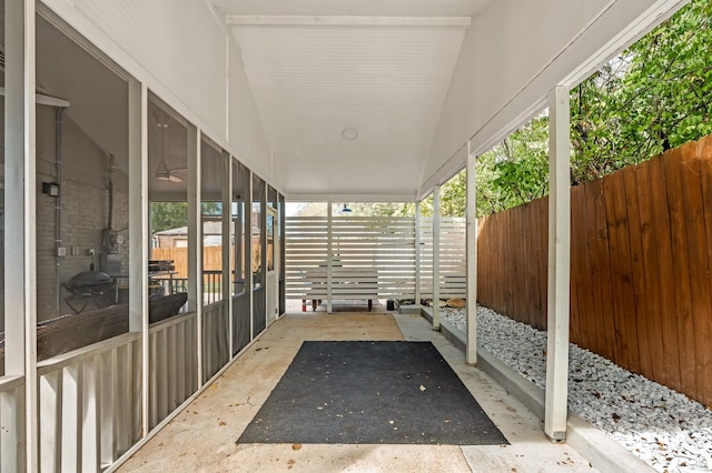 view of patio with a sunroom