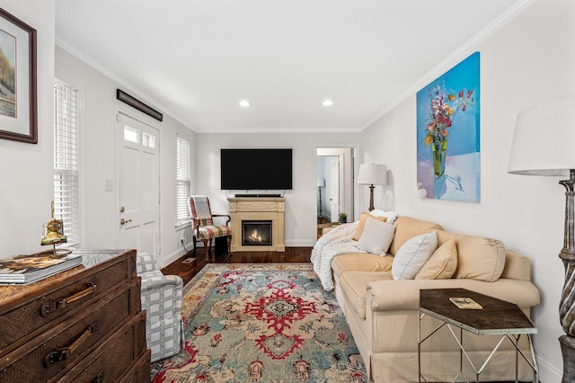 living room featuring hardwood / wood-style flooring and crown molding