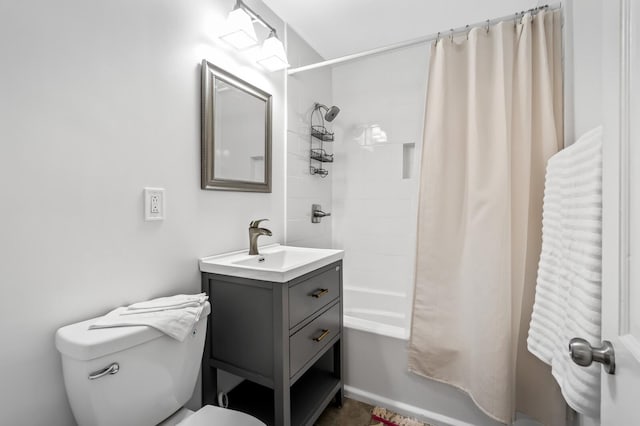 full bathroom with shower / tub combo with curtain, vanity, and toilet