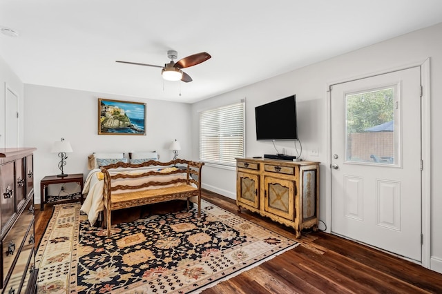 bedroom featuring ceiling fan and dark wood-type flooring