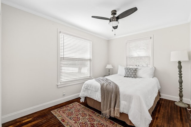 bedroom with ceiling fan, dark hardwood / wood-style floors, and ornamental molding