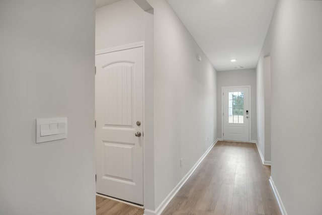 hall with light wood-type flooring